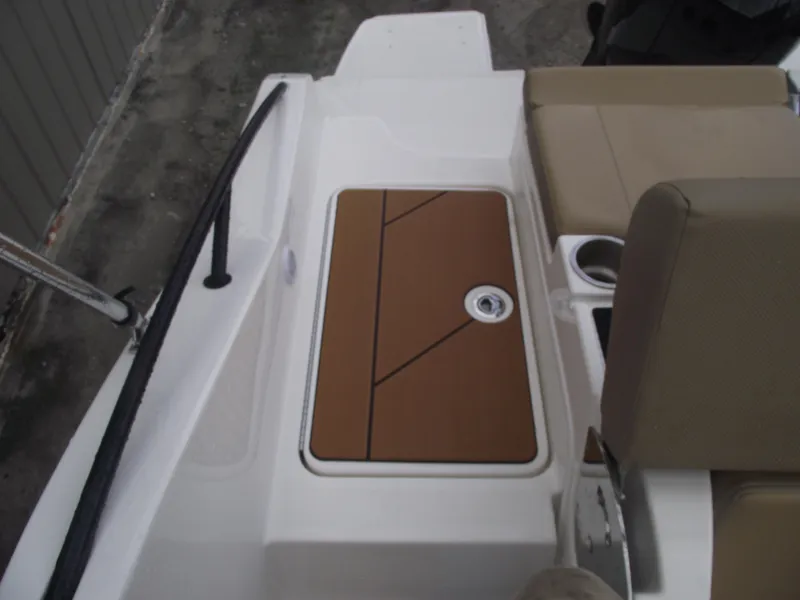 Slide: The Image of 2025 Bayliner D20 boat interior with storage compartment and seating. - 32
