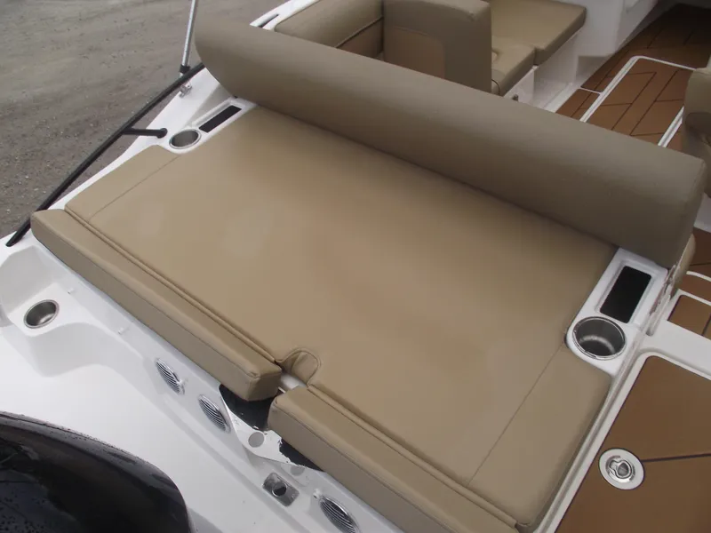 Slide: The Image of 2025 Bayliner D20 boat with beige seating and cup holders. - 35