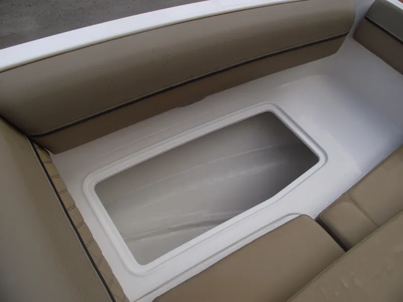 Slide: The Image of 2025 Bayliner D20 boat interior storage compartment with beige seating. - 9