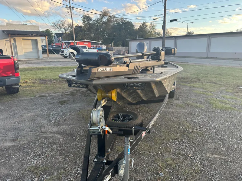 Slide: The Image of 2022 War Eagle 2070 Blackhawk boat on trailer in outdoor setting. - 10