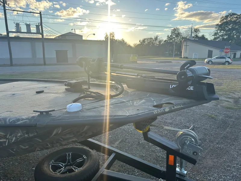 Slide: The Image of 2022 War Eagle 2070 Blackhawk boat on trailer at sunset. - 11
