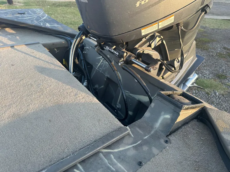 Slide: The Image of 2022 War Eagle 2070 Blackhawk boat with motor and steering components. - 17