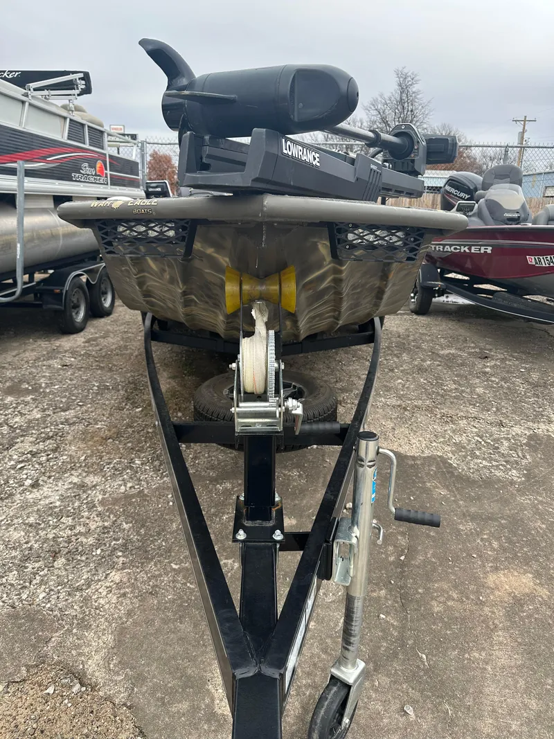 Slide: The Image of 2022 War Eagle 2070 Blackhawk boat on trailer, featuring a Lowrance system. - 19