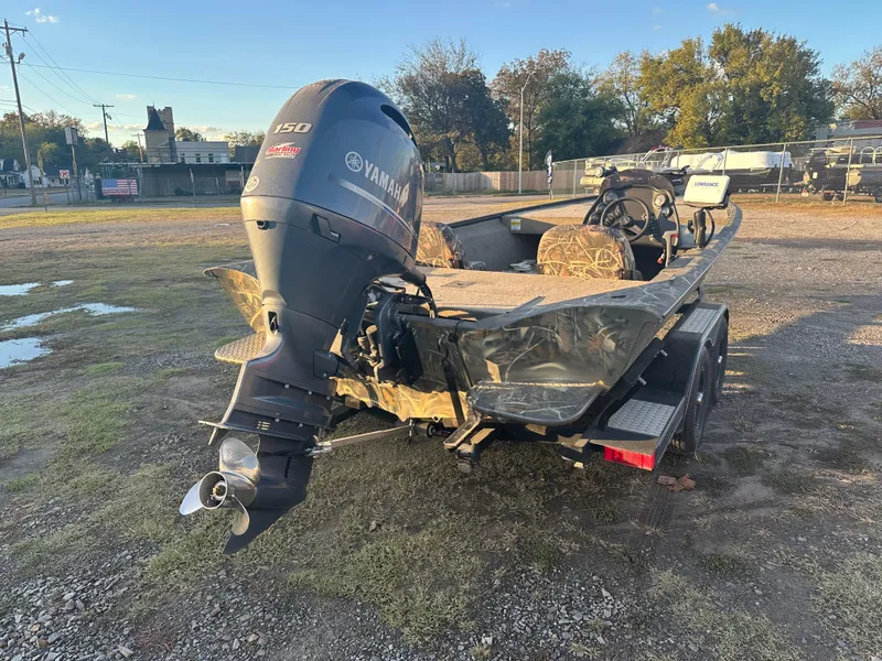 Slide: The Image of 2022 War Eagle 2070 Blackhawk boat with Yamaha motor in outdoor setting. - 4