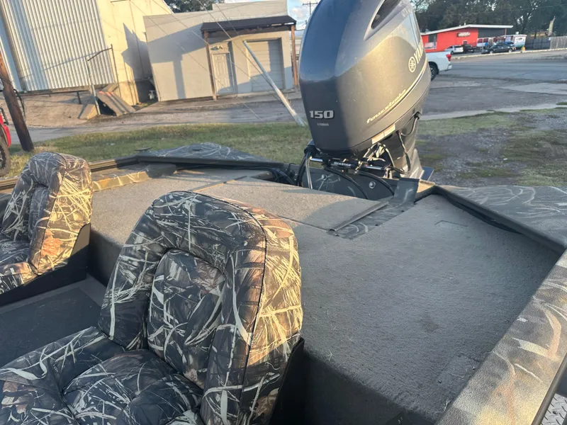 Slide: The Image of 2022 War Eagle 2070 Blackhawk boat with camo seats and Yamaha 150 engine. - 7