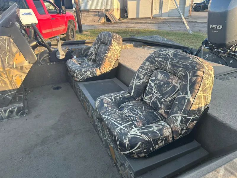 Slide: The Image of 2022 War Eagle 2070 Blackhawk boat with camo seats and Yamaha 150 engine. - 9