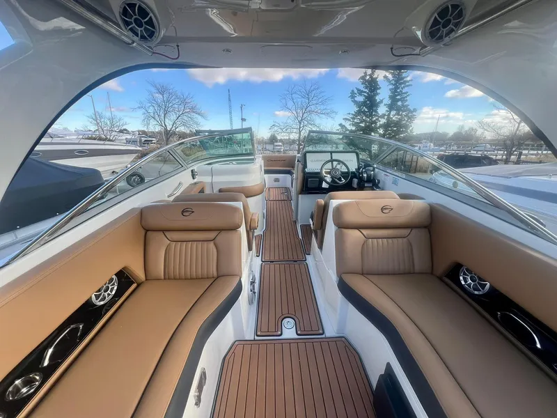 Slide: The Image of 2025 Crownline 310 XSS boat interior with luxurious seating and sleek design. - 1