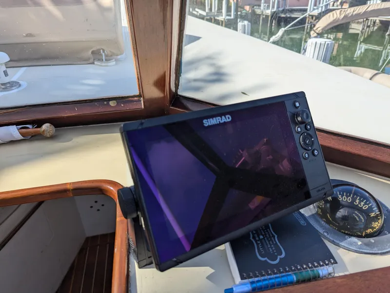 Slide: The Image of Simrad navigation system on 1951 Huckins Fairform Flyer boat dashboard. - 13