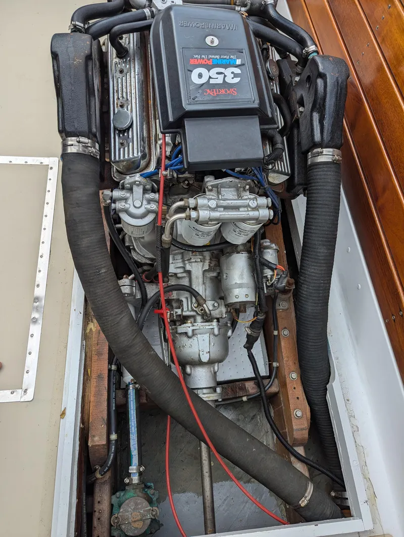 Slide: The Image of 1951 Huckins Fairform Flyer engine compartment with MerCruiser 350 engine. - 33