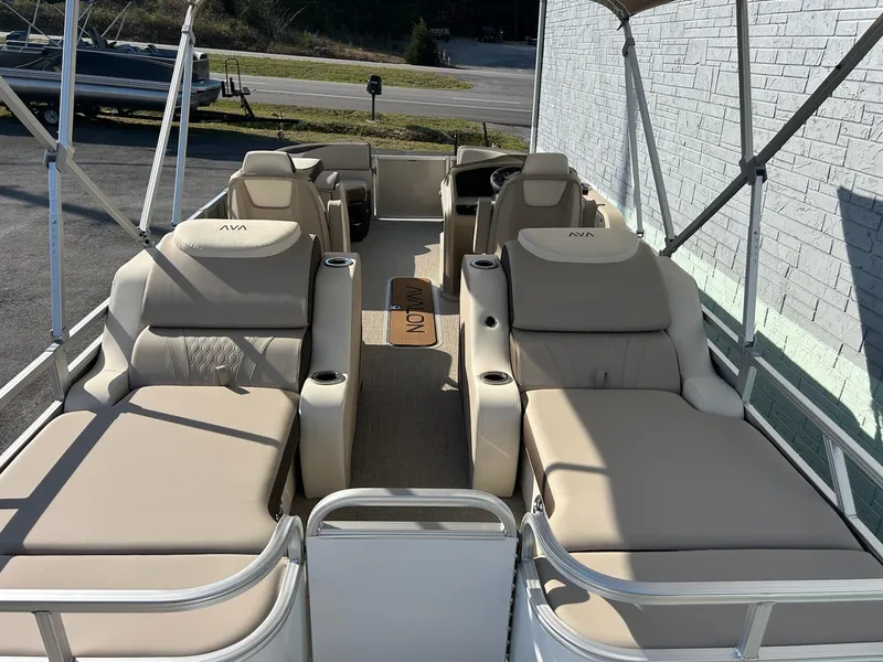 Slide: The Image of 2025 Avalon 2385 LSZ Rear Lounger pontoon boat with beige seating and spacious layout. - 10