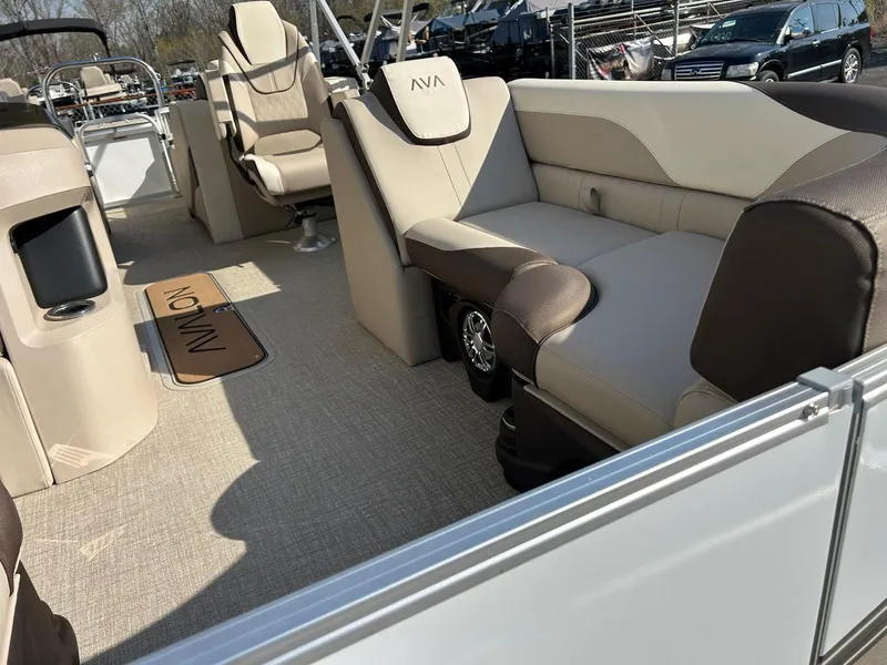 Slide: The Image of 2025 Avalon 2385 LSZ Rear Lounger boat interior with beige and brown seating. - 6