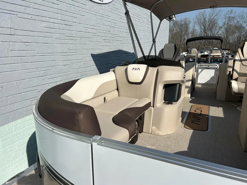 Slide: The Image of 2025 Avalon 2385 LSZ Rear Lounger pontoon boat with beige and brown seating. - 7