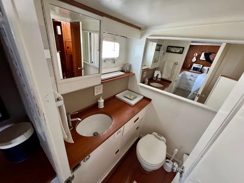 Slide: The Image of 1972 Stephens Brothers Flush Deck Motoryacht bathroom with wood accents and modern fixtures. - 21