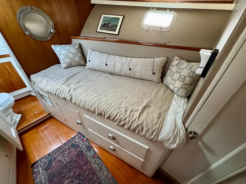 Slide: The Image of 1972 Stephens Brothers Flush Deck Motoryacht interior with cozy bed and nautical decor. - 30