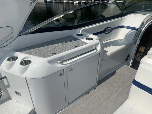 Slide: The Image of 2008 Formula 310 Sun Sport boat interior with sleek seating and storage. - 12