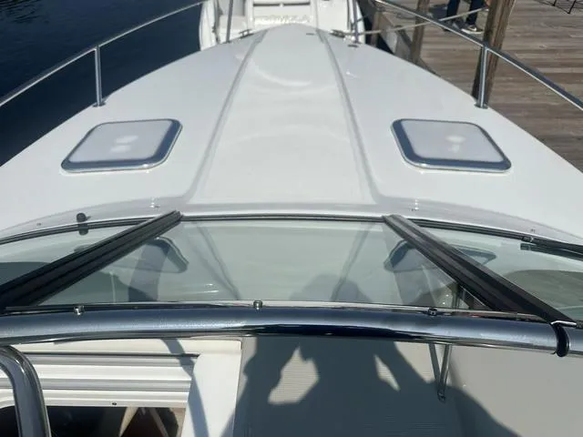 Slide: The Image of 2008 Formula 310 Sun Sport boat deck with sleek design and railing. - 16