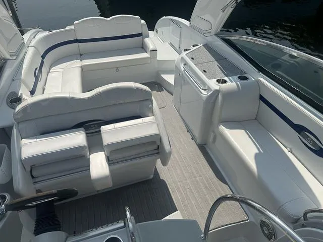 Slide: The Image of 2008 Formula 310 Sun Sport boat interior with white seating and sleek design. - 17