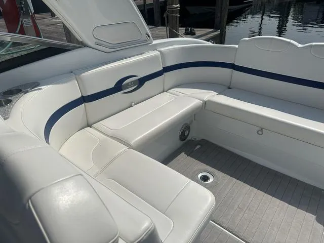 Slide: The Image of 2008 Formula 310 Sun Sport boat interior with white seating and blue accents. - 18