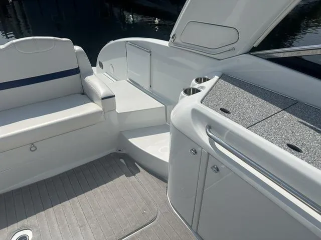 Slide: The Image of 2008 Formula 310 Sun Sport boat interior with seating and storage compartments. - 19