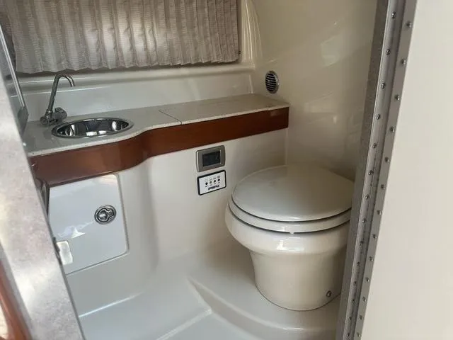 Slide: The Image of 2008 Formula 310 Sun Sport boat bathroom with sink and toilet. - 22