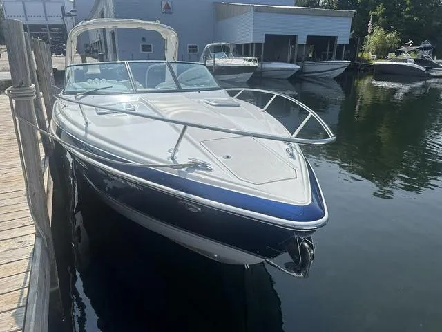 Slide: The Image of 2008 Formula 310 Sun Sport boat docked at marina, sleek design, calm water. - 6