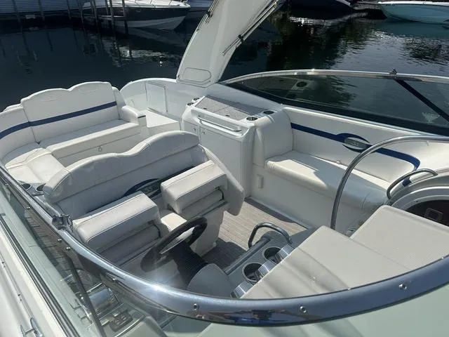 Slide: The Image of 2008 Formula 310 Sun Sport boat interior with white seating and steering wheel. - 7