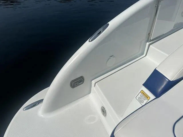 Slide: The Image of 2008 Formula 310 Sun Sport boat deck detail with sleek white design. - 9