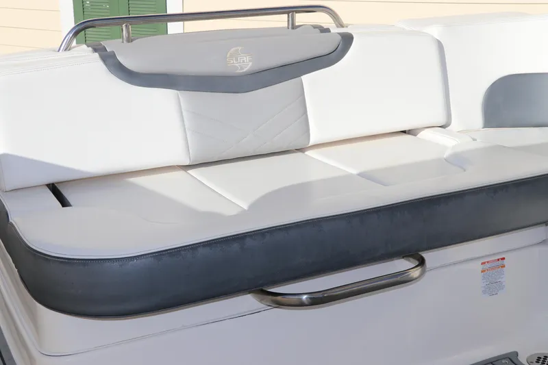 Slide: The Image of 2021 Chaparral 30 Surf boat seating area with cushioned backrest. - 11