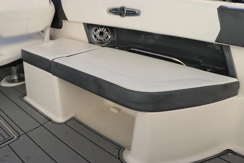 Slide: The Image of 2021 Chaparral 30 Surf boat interior seating with speaker and sleek design. - 14