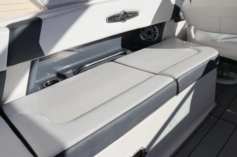 Slide: The Image of 2021 Chaparral 30 Surf boat interior seating with sleek design and integrated speaker. - 15