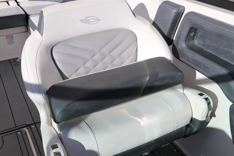 Slide: The Image of 2021 Chaparral 30 Surf boat seat with elegant gray and white upholstery. - 23