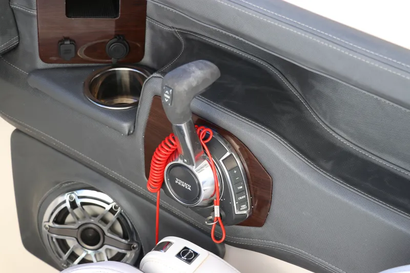 Slide: The Image of Control panel of 2021 Chaparral 30 Surf boat with throttle and speaker. - 27