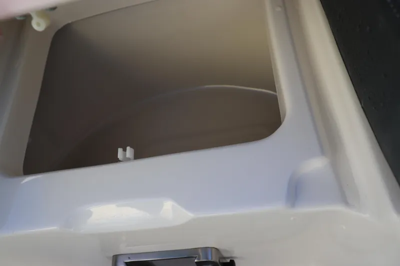 Slide: The Image of Storage compartment of 2021 Chaparral 30 Surf boat, open and empty. - 31