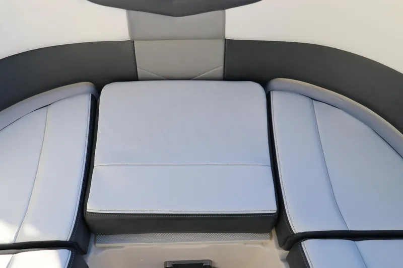 Slide: The Image of 2021 Chaparral 30 Surf boat interior seating, featuring sleek gray and black upholstery. - 32