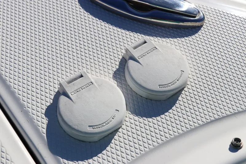 Slide: The Image of Close-up of 2021 Chaparral 30 Surf boat deck with two circular hatches. - 34