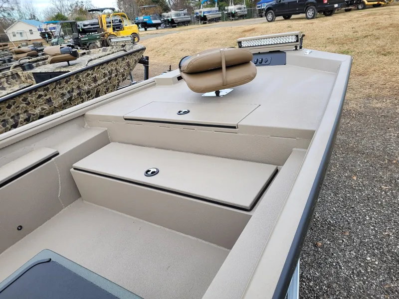 Slide: The Image of 2025 Excel 1960 Stalker SC boat interior with storage compartments and seating. - 10