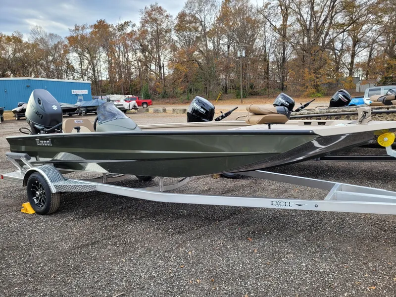 Slide: The Image of 2025 Excel 1960 Stalker SC boat on trailer, parked outdoors. - 2