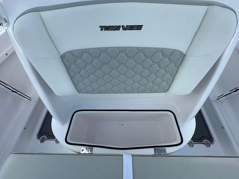 Slide: The Image of 2025 Twin Vee 240 GFX CC boat seat with storage compartment and hexagonal pattern. - 7