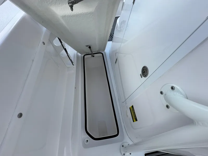 Slide: The Image of 2025 Twin Vee 240 GFX CC boat storage compartment, open and spacious design. - 8