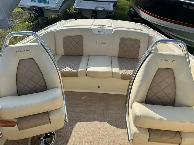 Slide: The Image of 2018 Chris-Craft Launch 23 boat interior with beige leather seating and elegant design. - 20