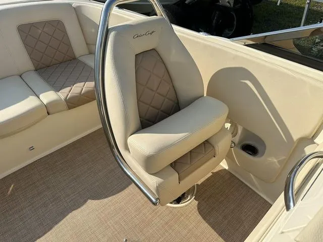 Slide: The Image of 2018 Chris-Craft Launch 23 boat interior with beige seating and diamond stitching. - 22