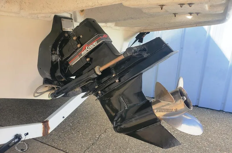 Slide: The Image of 1996 Sea Ray 215 Express Cruiser outboard motor and propeller detail. - 19