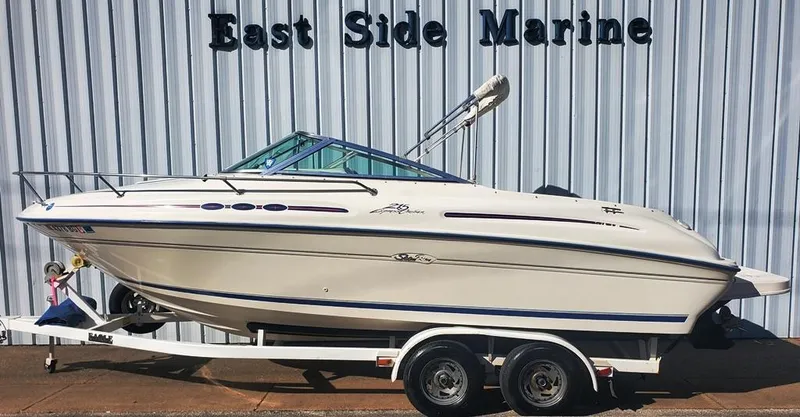 Slide: The Image of 1996 Sea Ray 215 Express Cruiser on trailer at East Side Marine. - 2