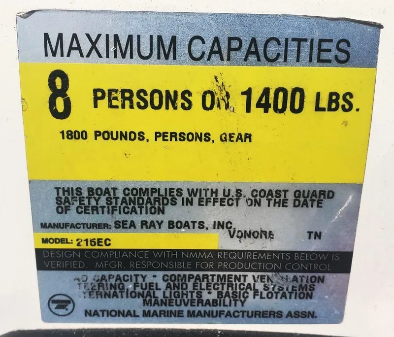 Slide: The Image of Sea Ray 215 Express Cruiser 1996 capacity label: 8 persons or 1400 lbs. - 25