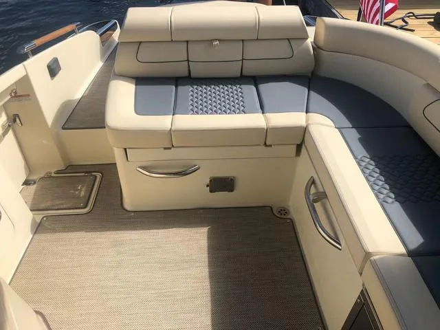 Slide: The Image of 2022 Chris-Craft Launch 28 GT boat interior with luxurious seating and elegant design. - 14