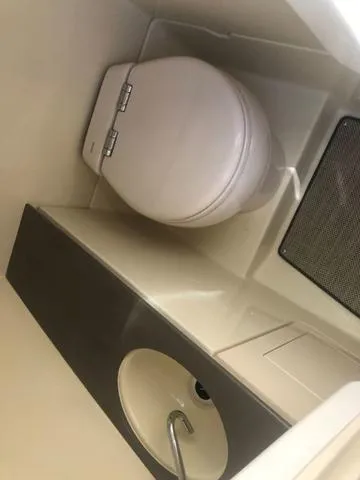 Slide: The Image of 2022 Chris-Craft Launch 28 GT boat bathroom with toilet and sink. - 16