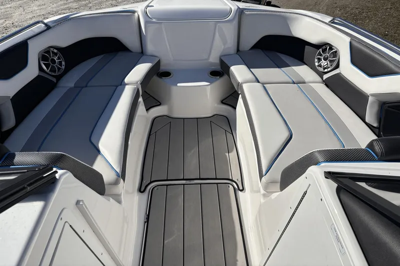 Slide: The Image of 2021 Yamaha Boats 212XE interior with sleek seating and modern design. - 11