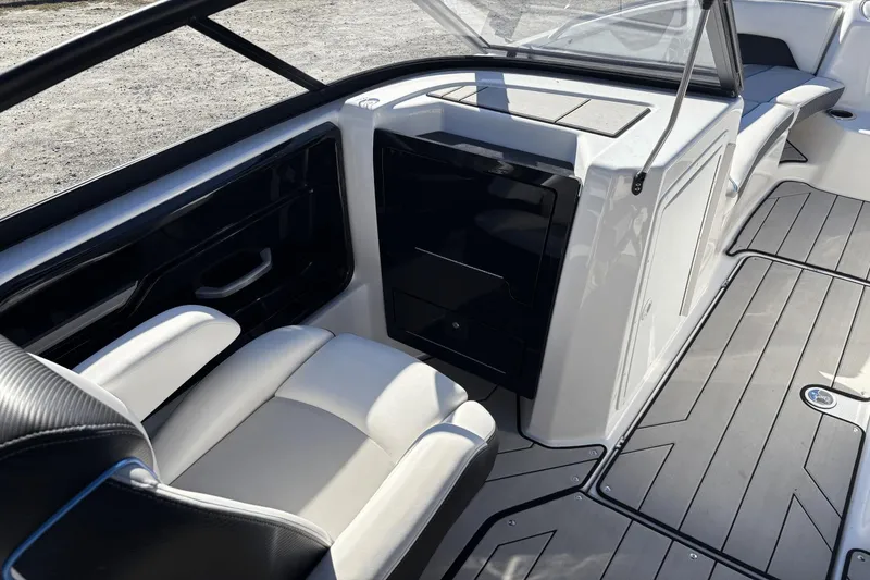 Slide: The Image of 2021 Yamaha Boats 212XE interior with sleek seating and modern design. - 12