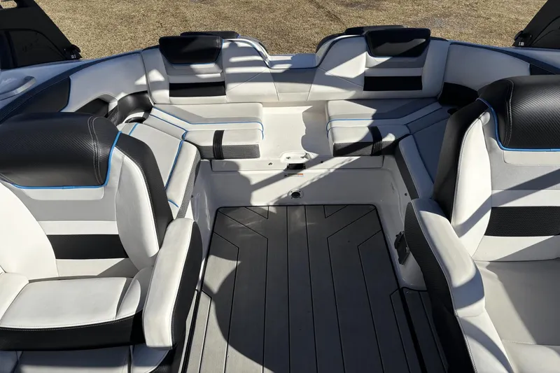 Slide: The Image of 2021 Yamaha Boats 212XE interior with sleek seating and modern design. - 13