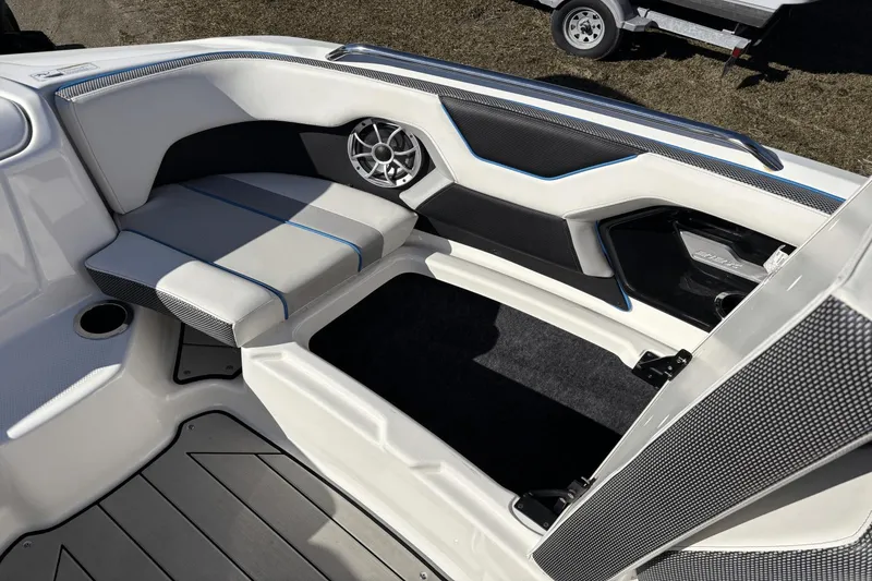 Slide: The Image of Interior of 2021 Yamaha Boats 212XE, featuring sleek seating and modern speaker design. - 14